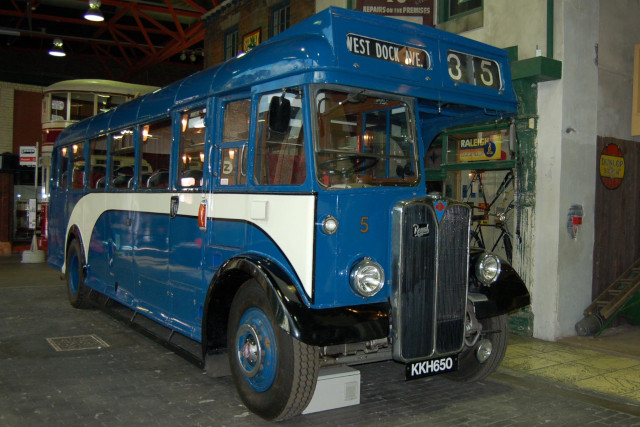 A blue and white vintage bus.