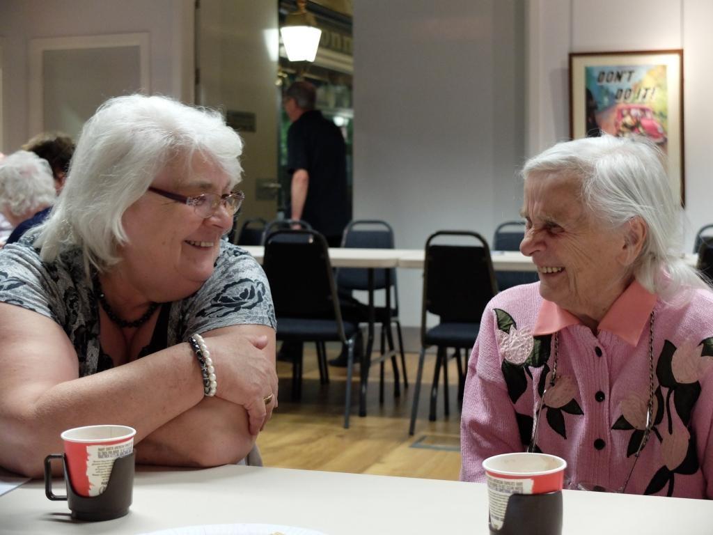 Two women sat talking.