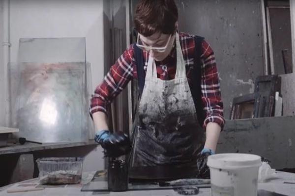 A woman working with printing materials