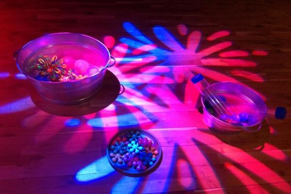 Bright colourful lights shining on a floor.