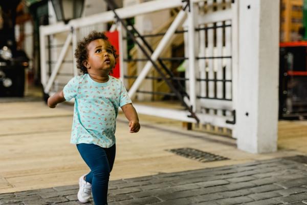 A girl running in a museum