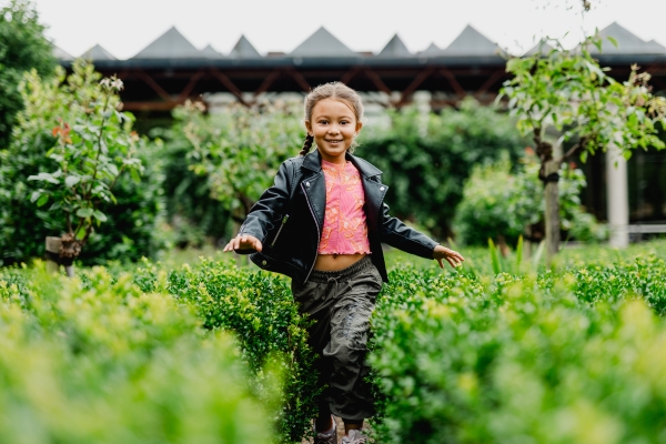 A girl running through a maze