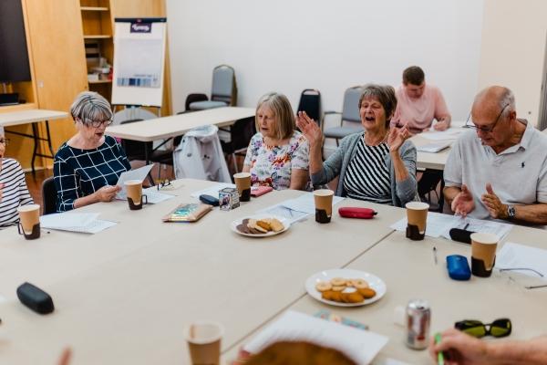 A group of people sat around a table