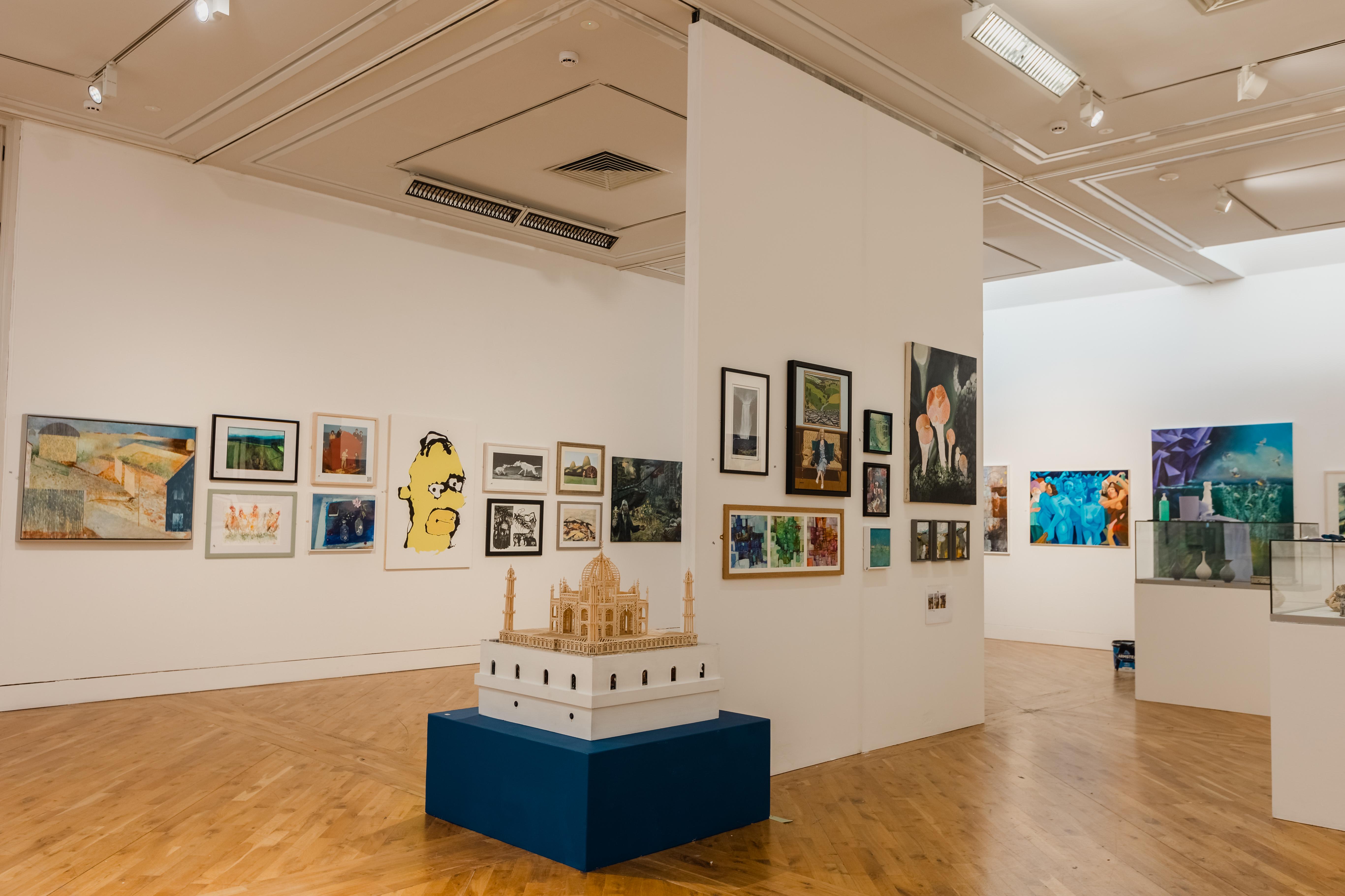 Paintings and sculptures in an art gallery