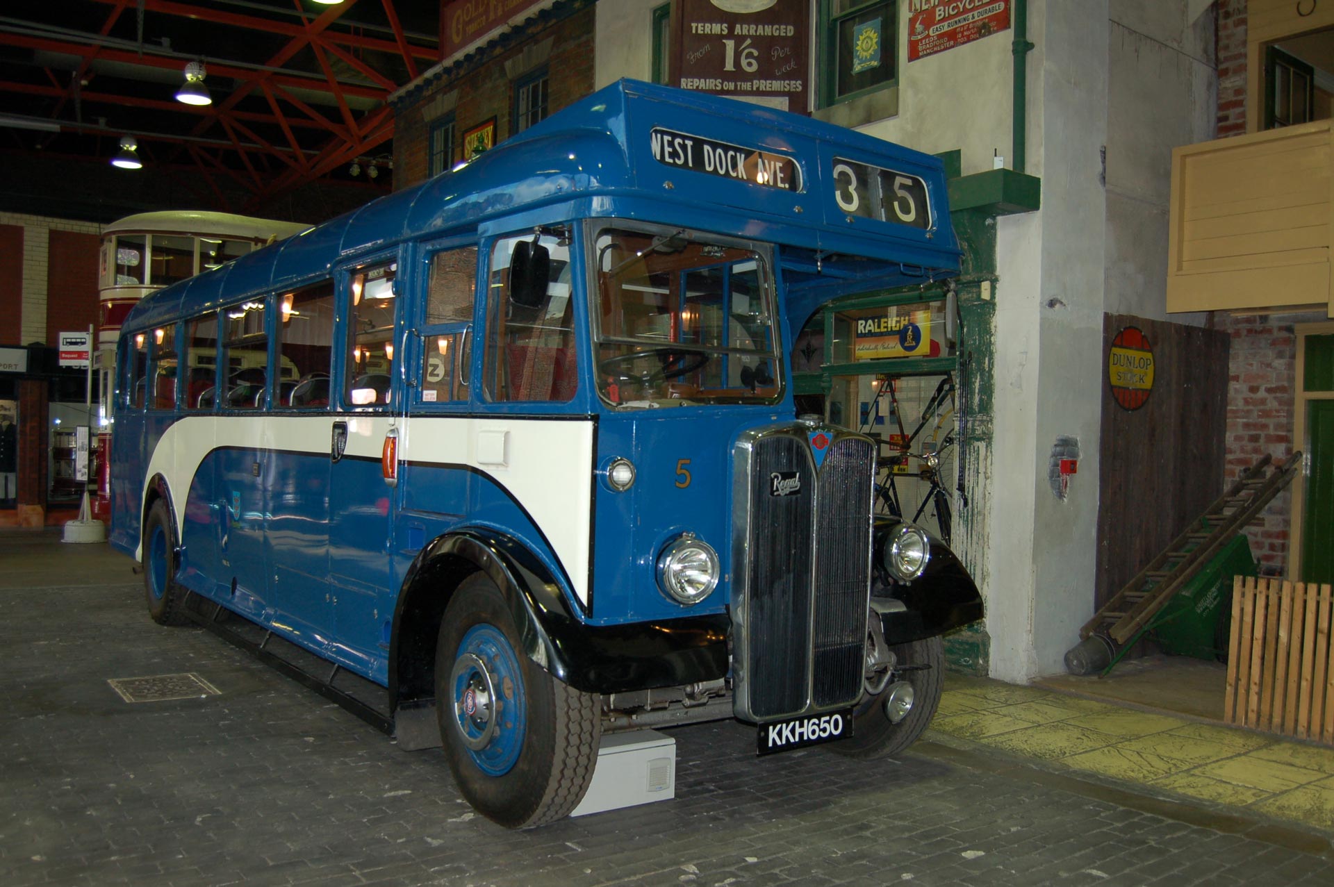A blue and white vintage bus