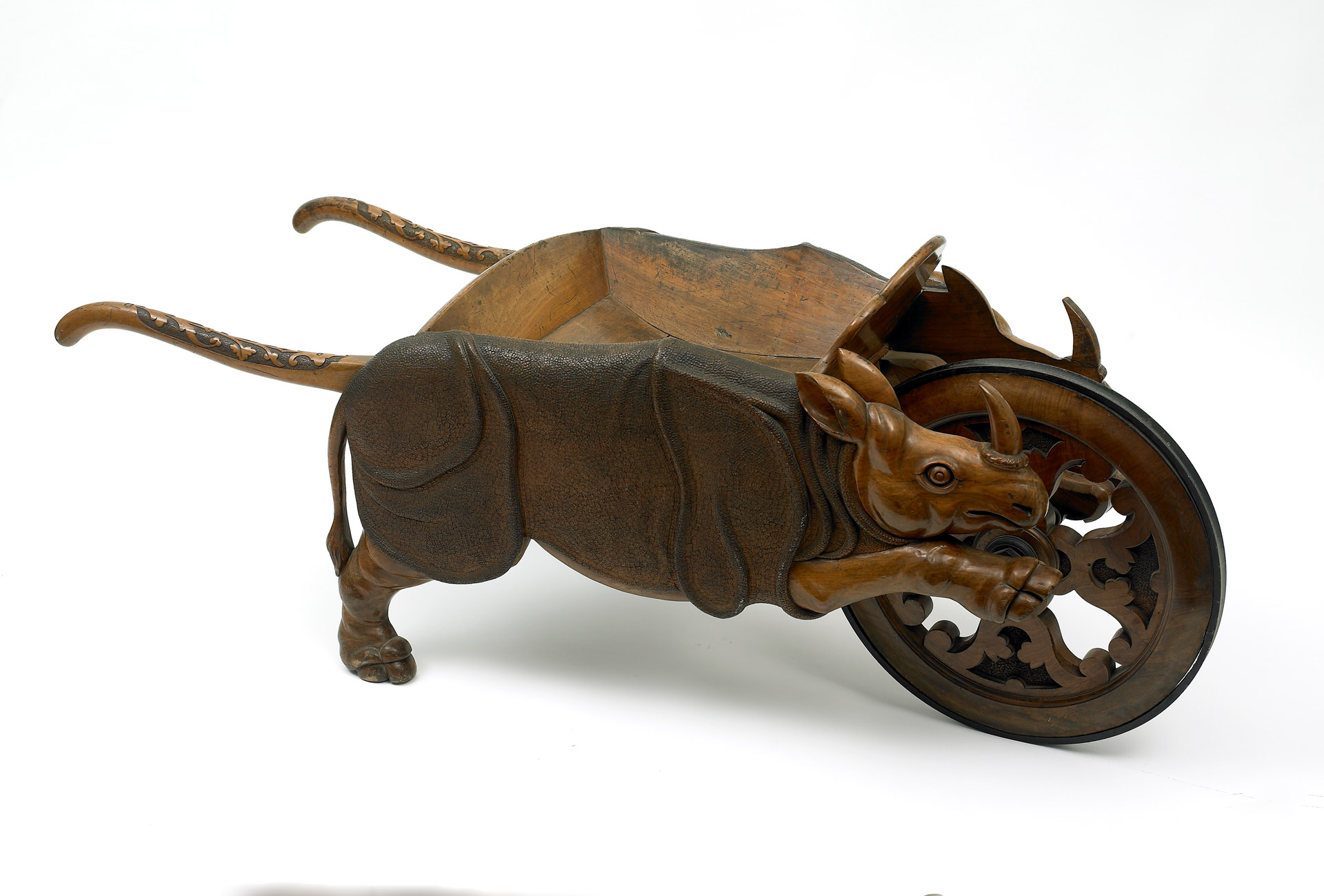 A wooden wheelbarrow made to look like a rhinoceros