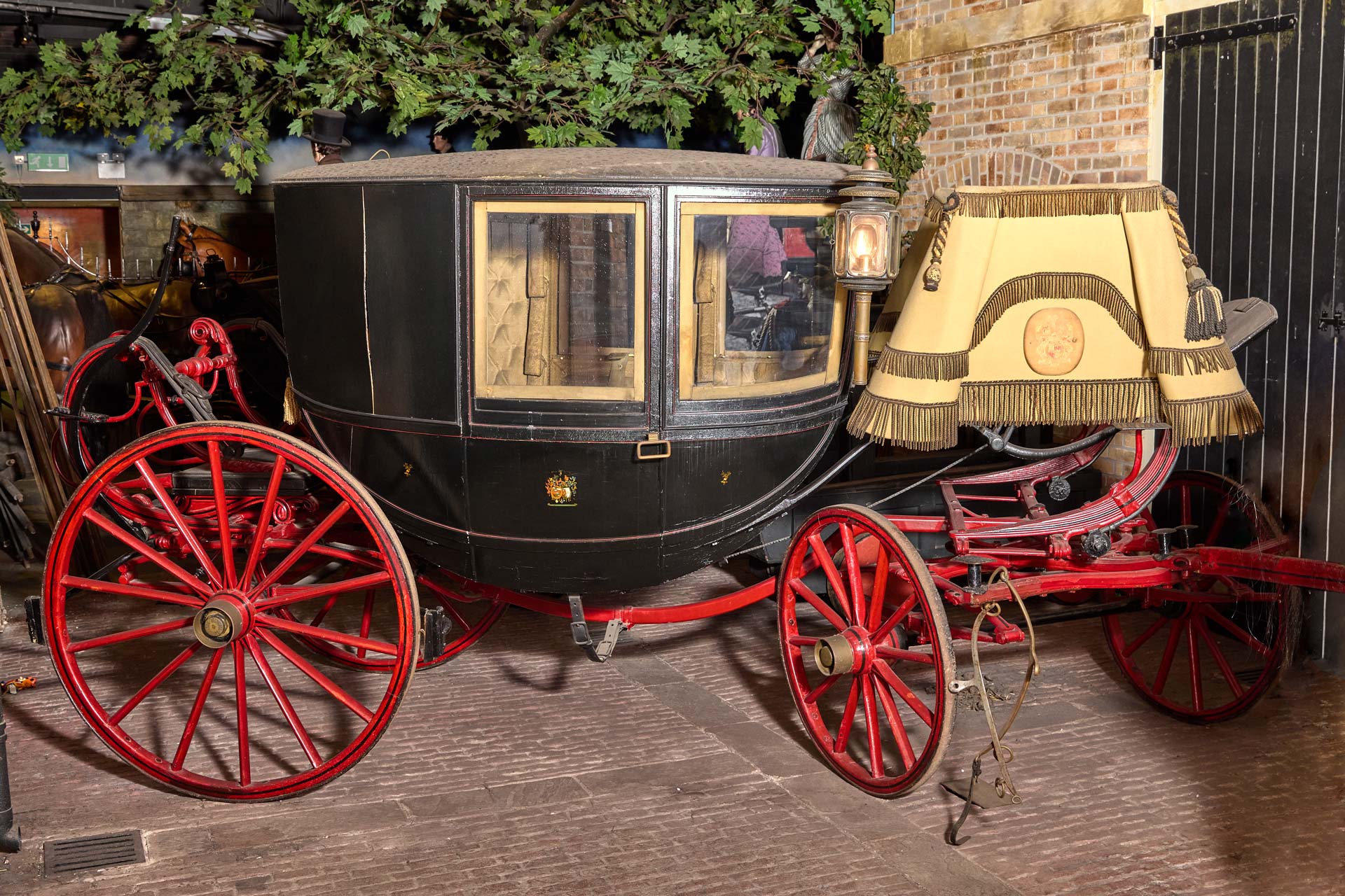 A vintage horse drawn carriage in a museum display