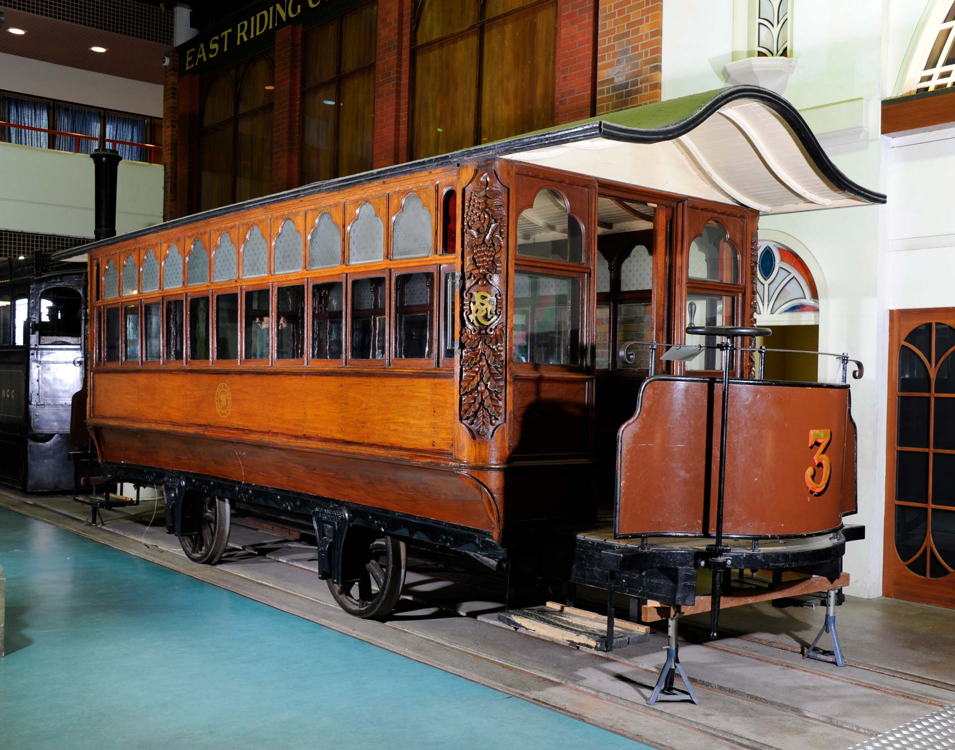 A vintage wooden tram in a museum
