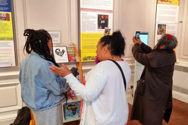 People looking at an exhibition.