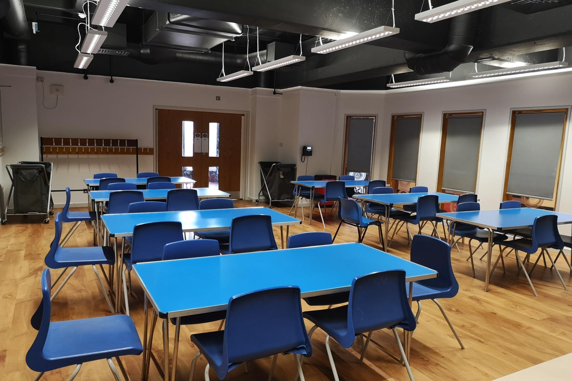 Blue chairs and tables in  a room