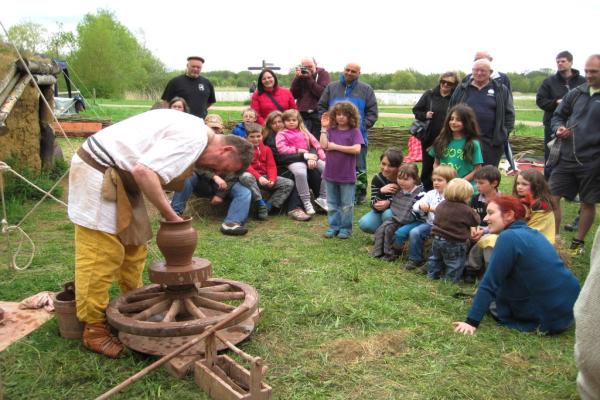 A person doing a pottery display