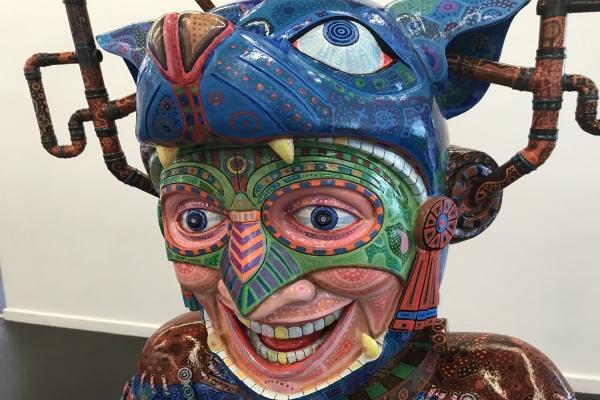 A colourful sculpture of a head