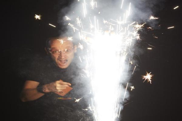 A man looking into a firework.