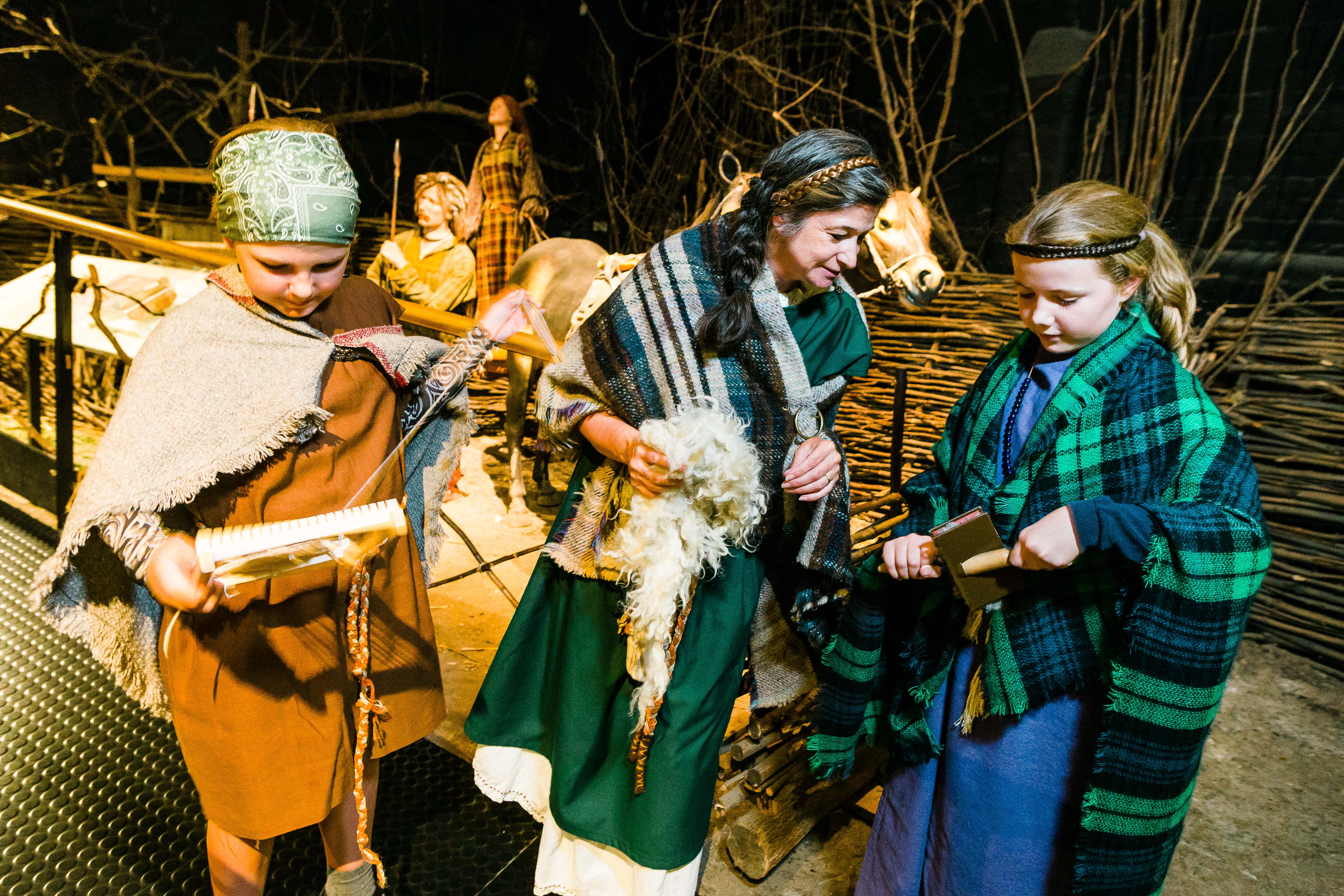 Children learning about life during the Iron Age.