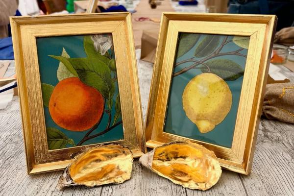 Two gold picture frames and two gold shells.