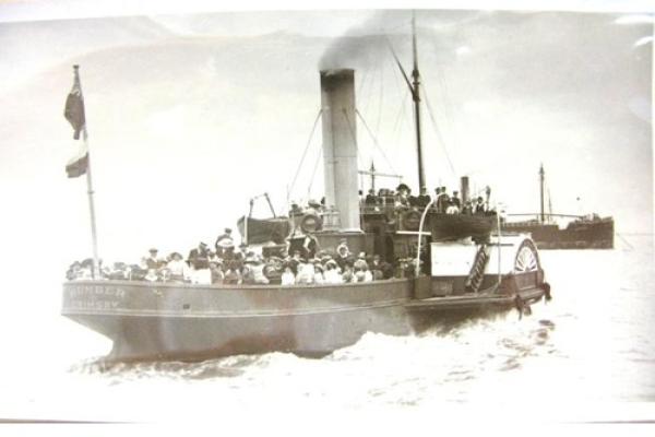 A black and white photo of a steam ship.