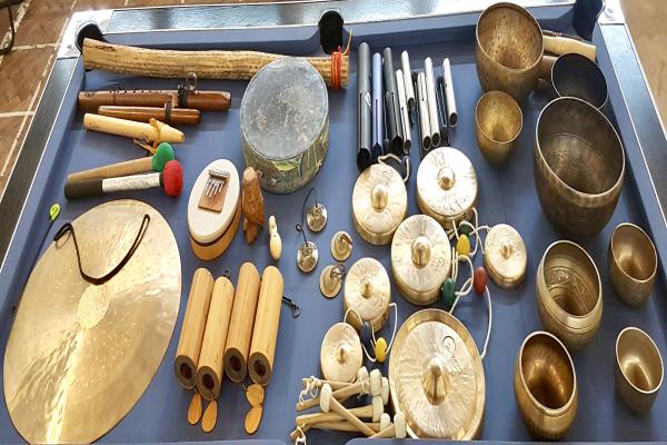 Various drum instruments laid out on a table