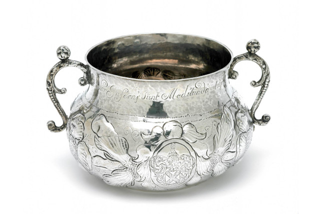 A large two handled silver pot