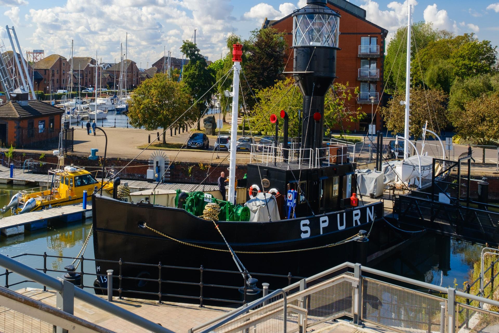A lightship in a marina