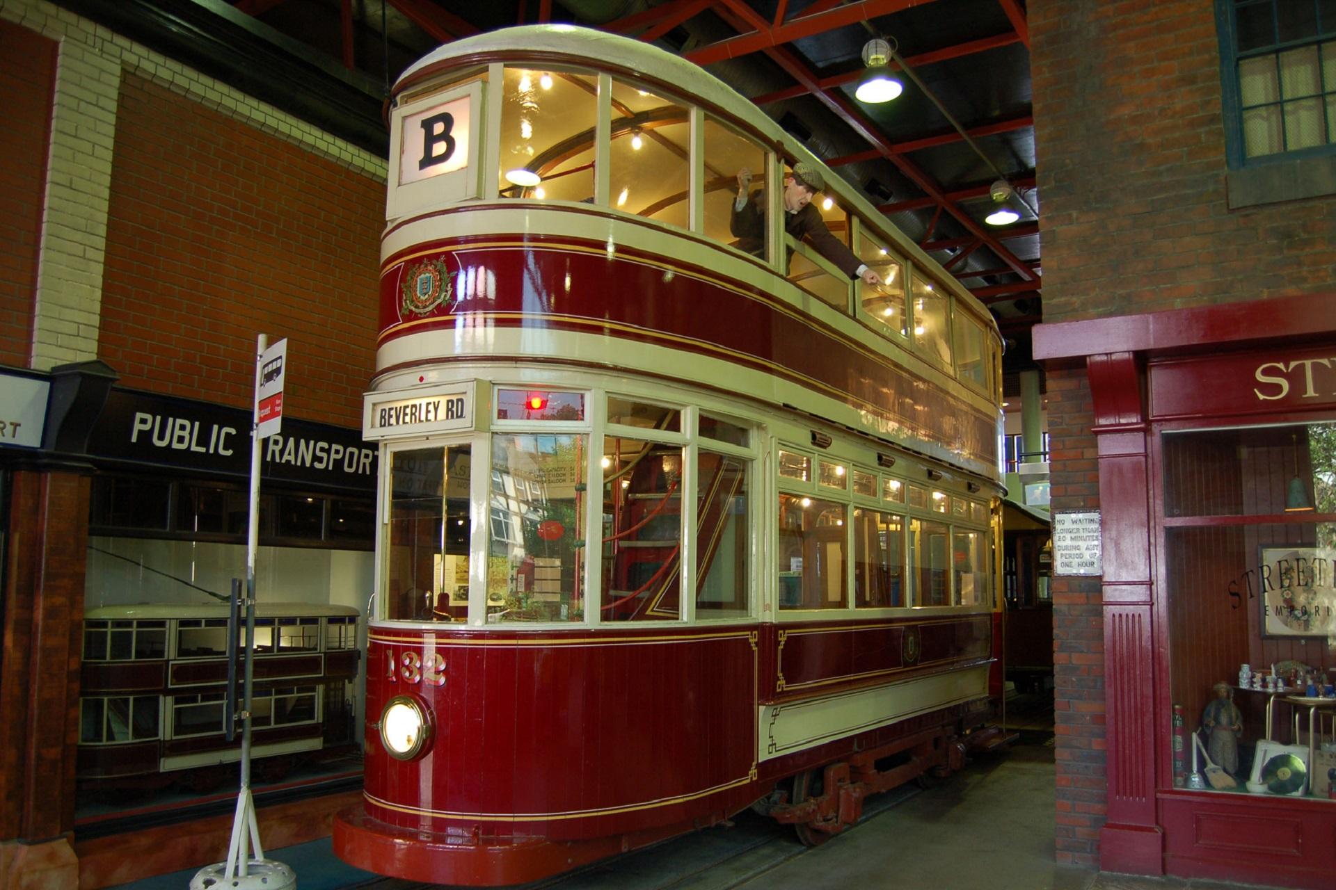 A red and cream double decker trolleybus.