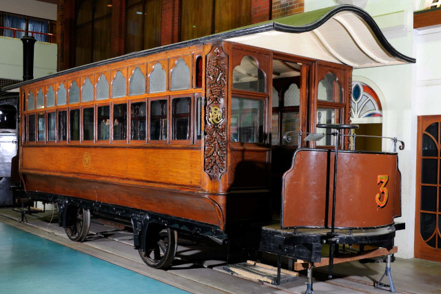 An old wooden tram in a museum
