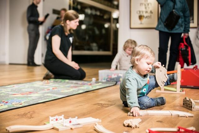 Under 5s playing with transport themed toys.