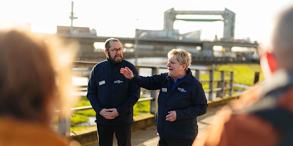 A woman and a man giving a guided tour