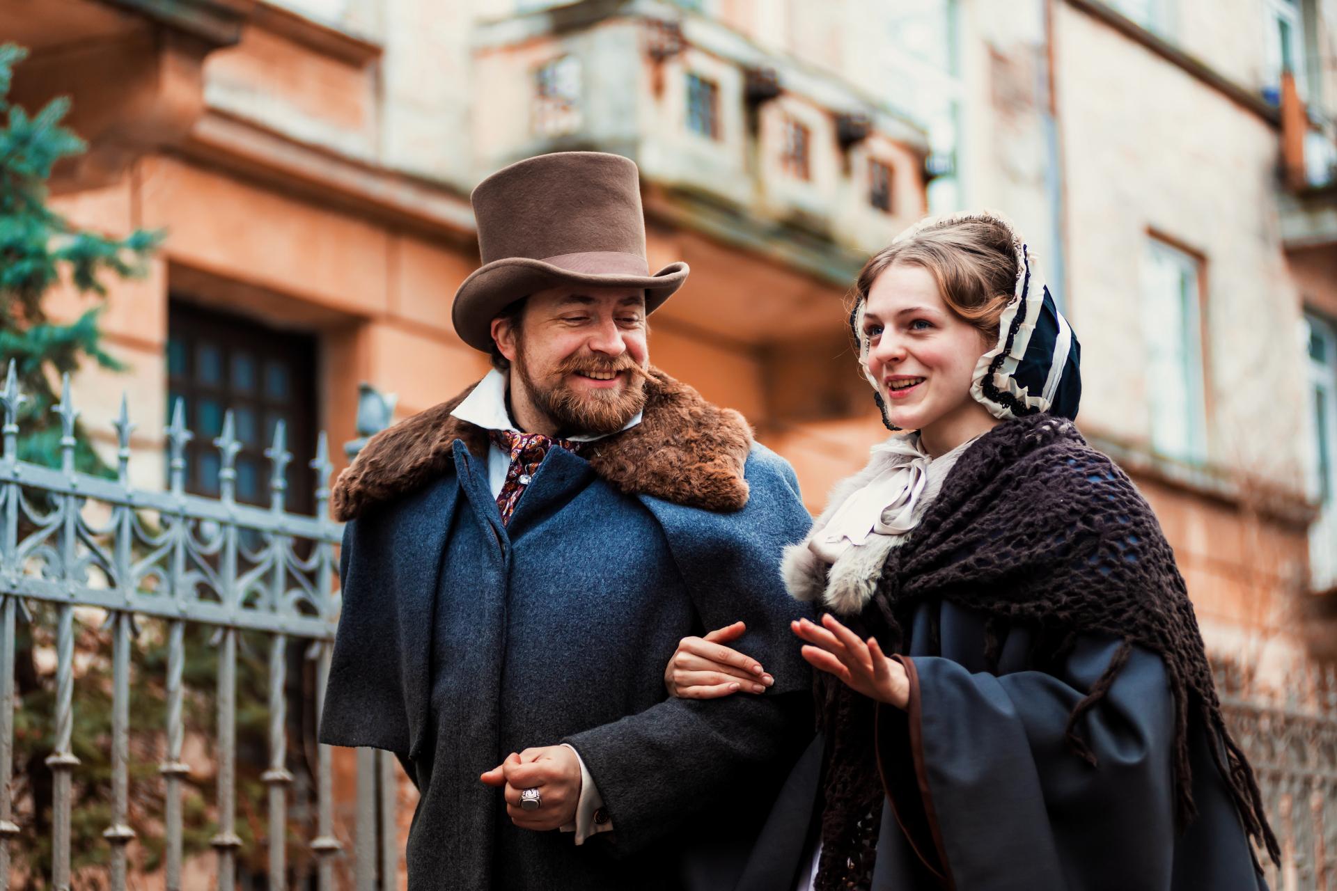 Two people dressed in Victorian clothing.